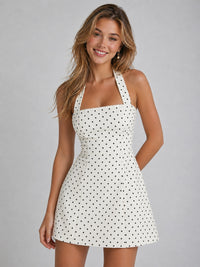 Functional side pockets on white polka dot mini dress