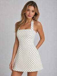 A-line skirt on black and white polka dot mini dress