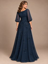 back view navy blue A-line mother of the bride dress with sheer puff sleeves and floral sequin appliqués  