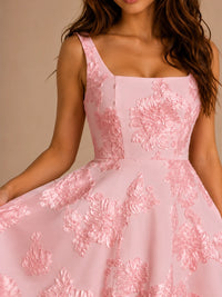 Close-up of blush pink 3D floral applique homecoming dress with square neckline, fitted bodice, and A-line skirt.