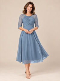 Jovellee dusty blue tea-length mother of the bride dress with pleated bodice and sheer lace 3/4 sleeves, front view
